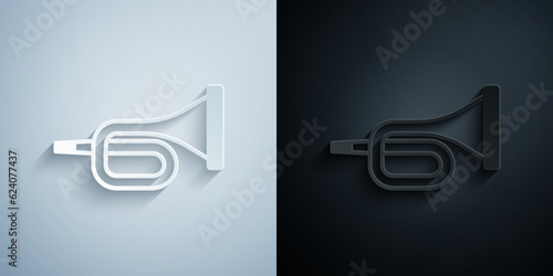 Paper cut Musical instrument trumpet icon isolated on grey and black background. Paper art style. Vector
