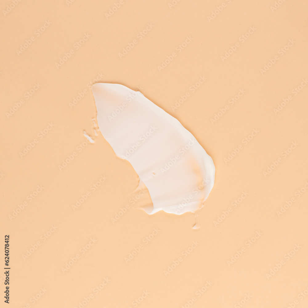 Smear of white cream for face and body on a brown background Smear of white cream for face and body on a brown background