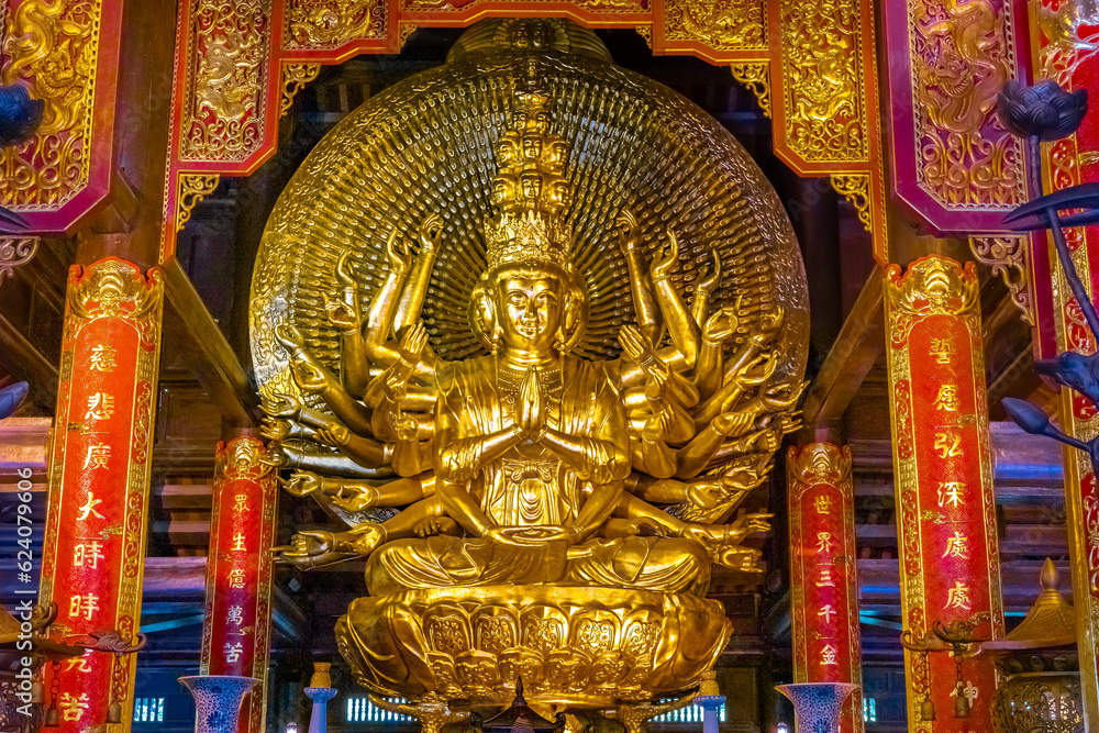 Fototapeta premium Bai Dinh Buddhist temple in Ning Binh Vietnam filled with architectural marvels of statues icons and magnificent Buddha buildings with classic ancient design 