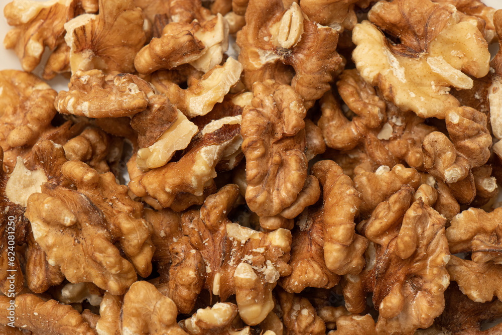 Baked walnuts skin texture. Food background. Baked walnuts skin texture. Food background.