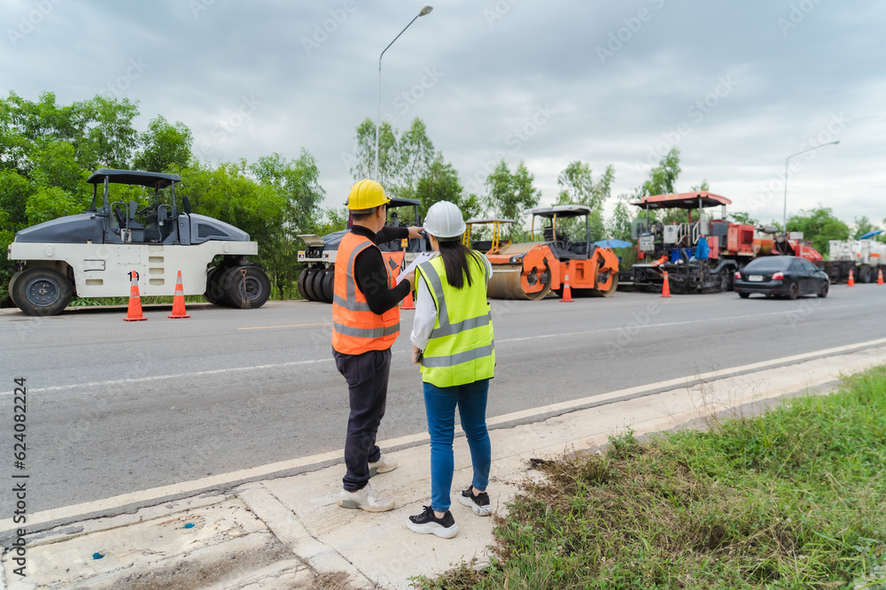 Female civil engineers consult with or with contractors to build rural roads using online technology. Female civil engineers consult with or with contractors to build rural roads using online technology.