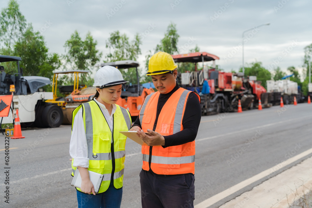 Female civil engineers consult with or with contractors to build rural roads using online technology. Female civil engineers consult with or with contractors to build rural roads using online technology.