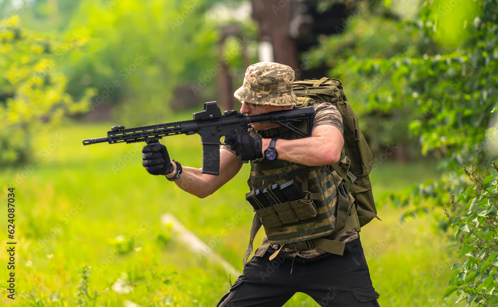 Man firing a rifle