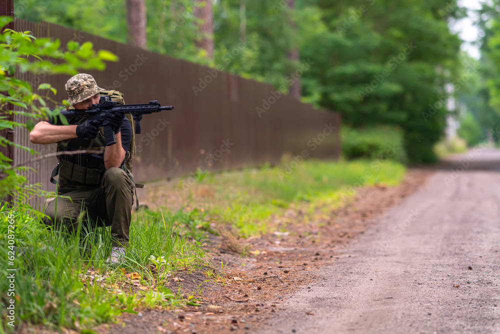 Soldier looking through the scope of a rifle