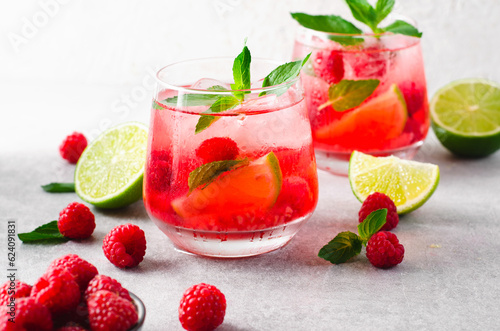 Refreshing Cold Cocktail or Mocktail with Berries and Lime, Raspberry Lemonade