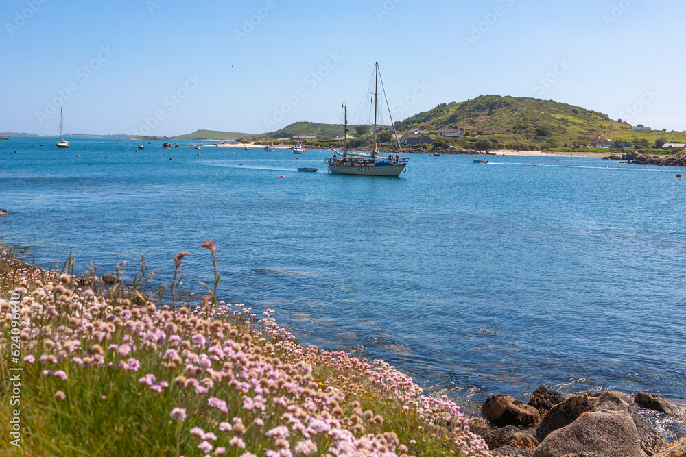 A yacht about to drop anchor in New Grimsby Sound between Tresco and Bryher, Isles of Scilly, UK A yacht about to drop anchor in New Grimsby Sound between Tresco and Bryher, Isles of Scilly, UK