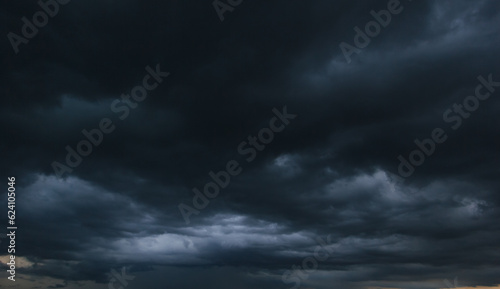 Canvas Print The dark sky with heavy clouds converging and a violent storm before the rain
