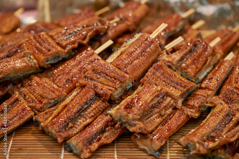 Grilled eel skewers at traditional market