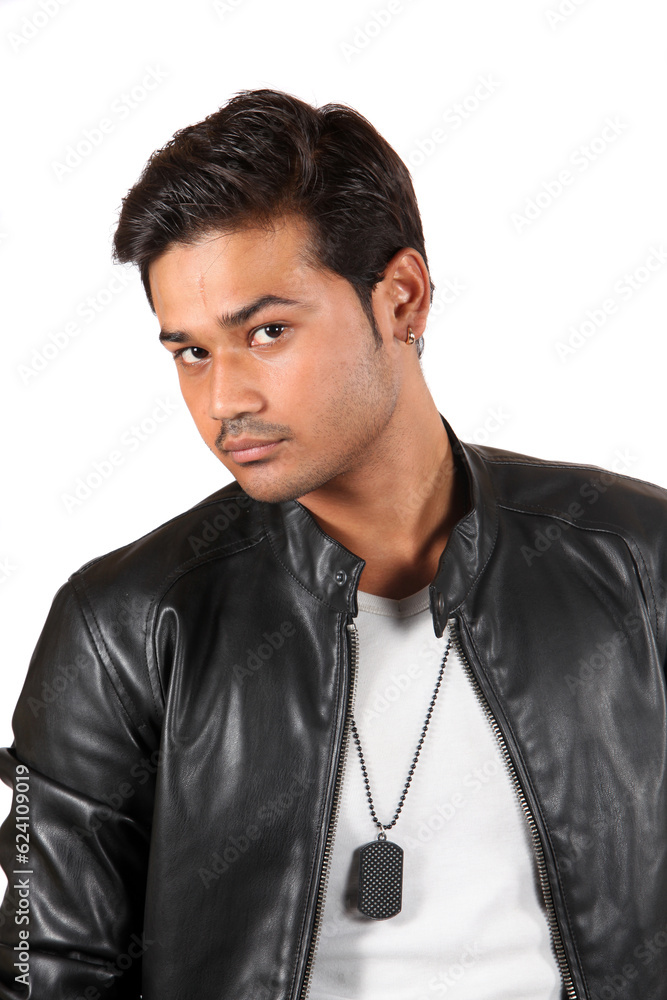 A portrait of an anxious looking young Indian guy, on white studio background.