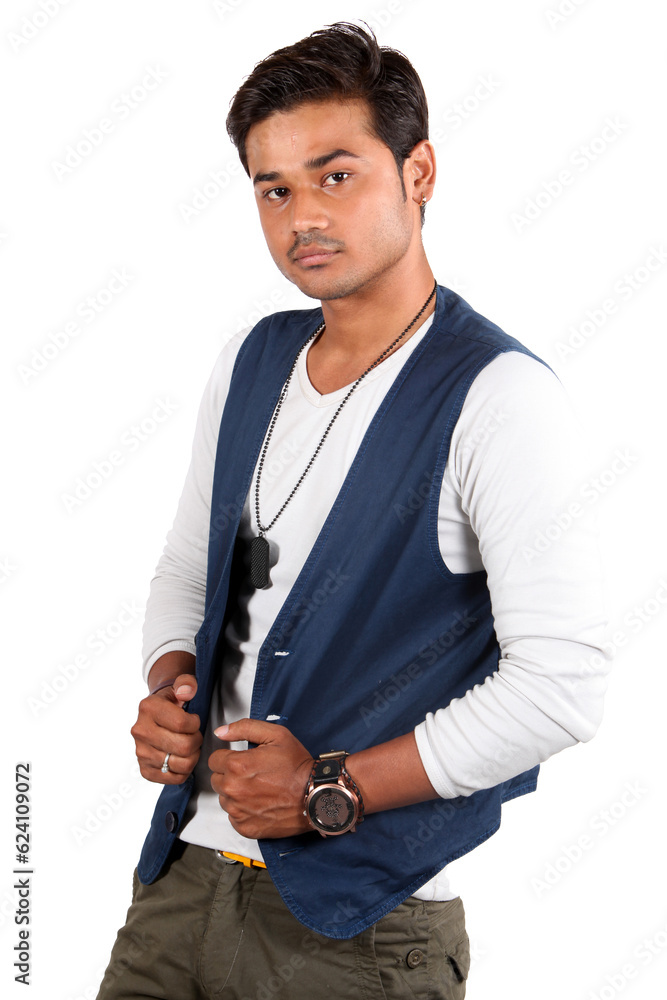 A young handsome Indian guy wearing a sleeveless blue jacket.