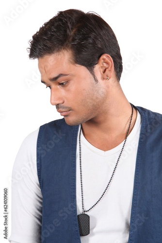 Obraz na płótnie A young sad Indian guy lost in his thoughts, on white studio background. w salonie