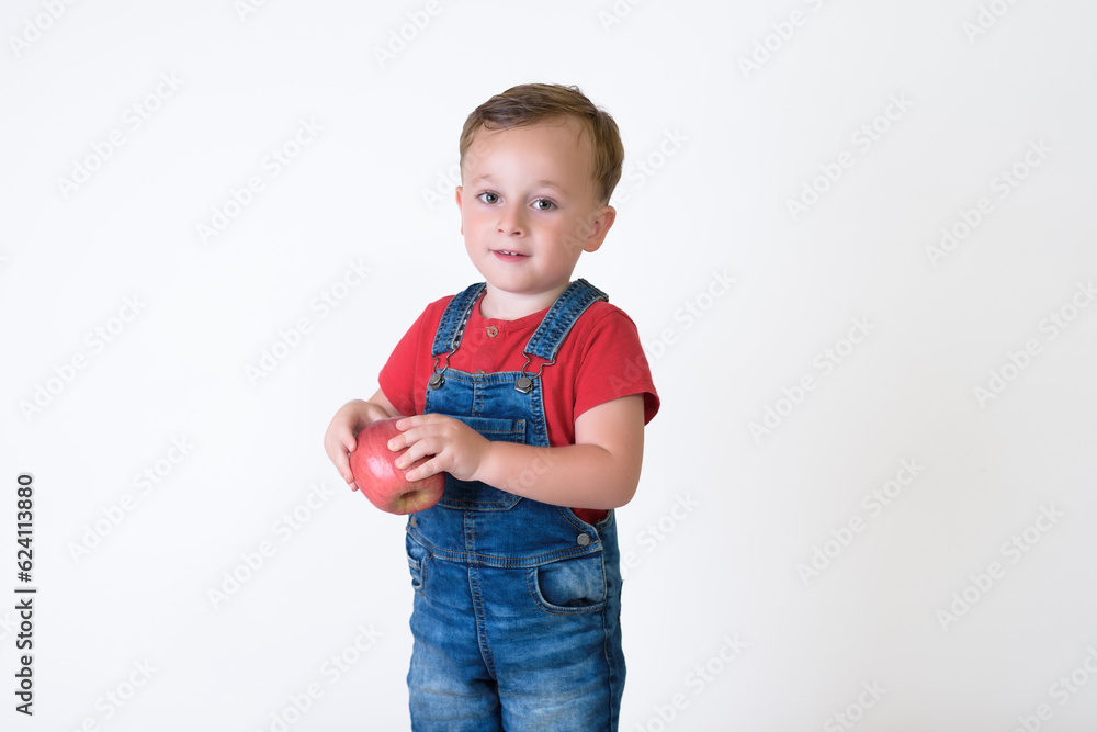 portrait of a girl eating red apple isolated on white. Healthy nutrition. free space portrait of a girl eating red apple isolated on white. Healthy nutrition. free space