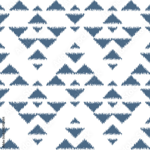 Seamless ikat pattern with blue elements on white background.