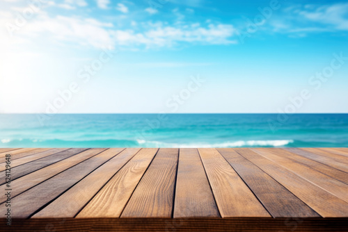 Wooden table top on blurred beach background - can be used for display or montage your products. High quality photo