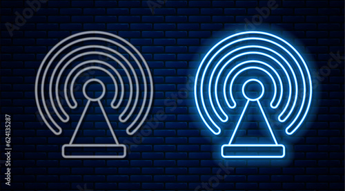 Glowing neon line Radar icon isolated on brick wall background. Search system. Satellite sign. Vector