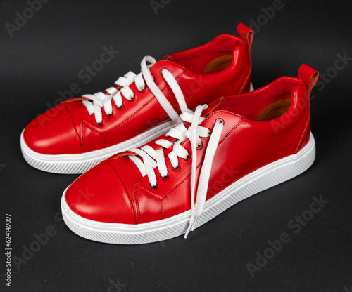 NEW Red leather sneakers with white soles on a black background