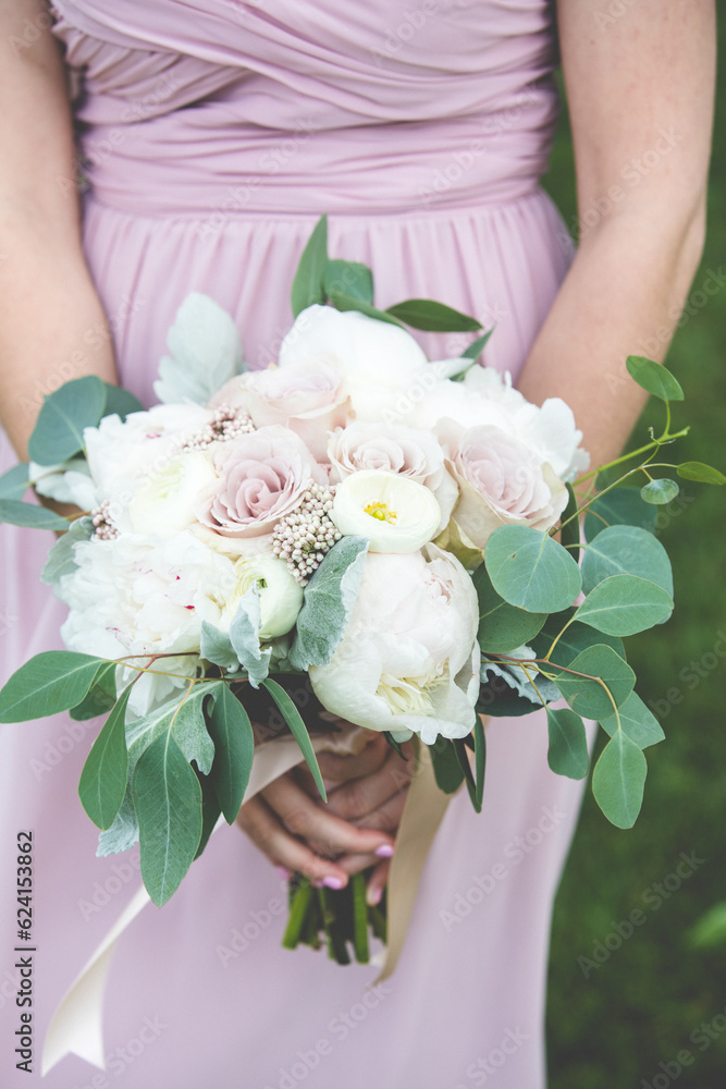 Wedding Flower Bouquet being held in hands Wedding Flower Bouquet being held in hands
