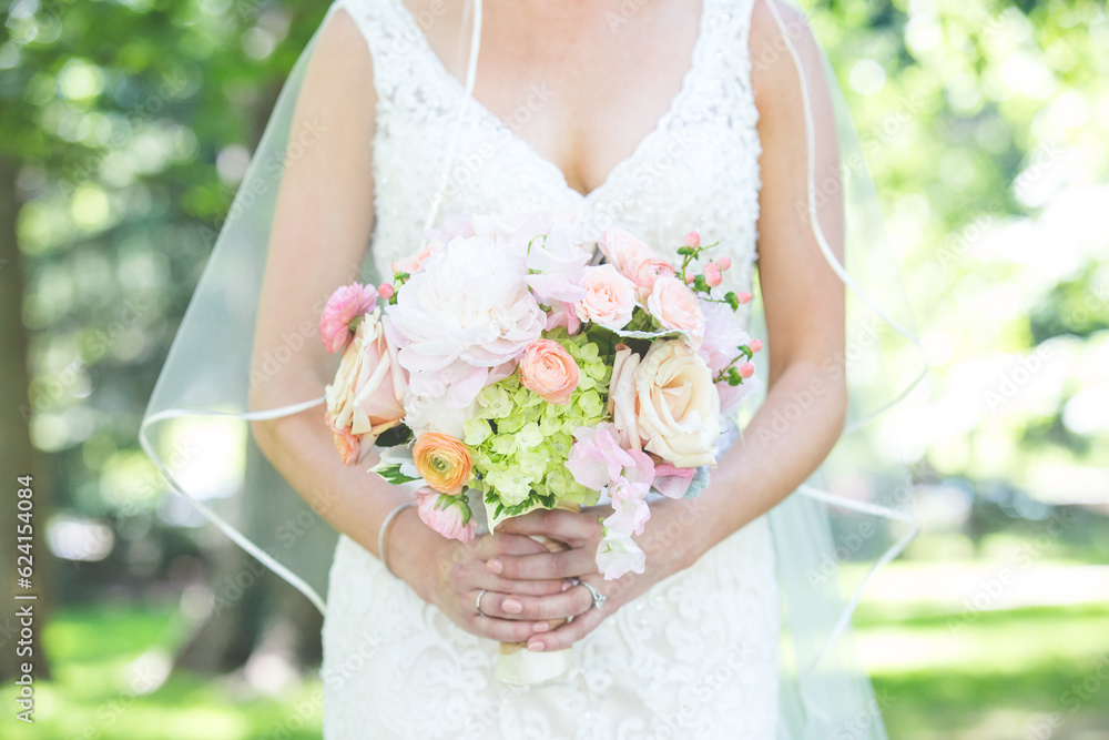 Wedding Flower Bouquet being held in hands Wedding Flower Bouquet being held in hands
