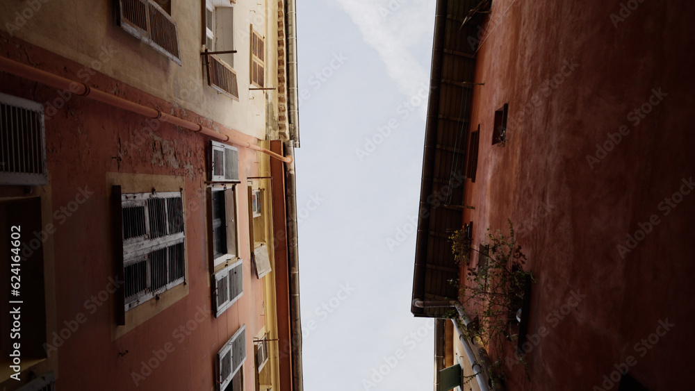 Worms eye slow motion shot of old town of Nice in spring