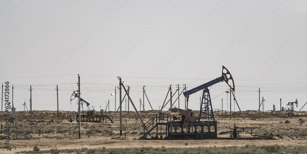 Land drilling rigs for oil production in the Kazakh steppes, industrial structures for oil production