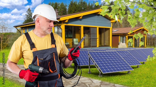 Man electrician. Solar pane...