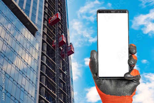 Phone in builder hand. Smar...