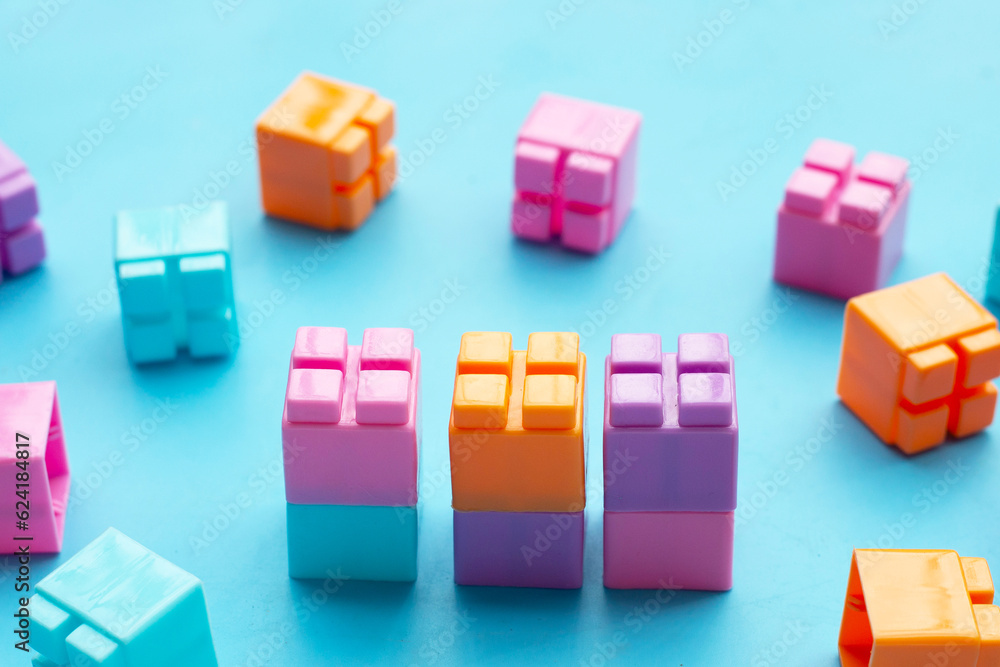 Plastic building blocks isolated on blue background. Top view Plastic building blocks isolated on blue background. Top view