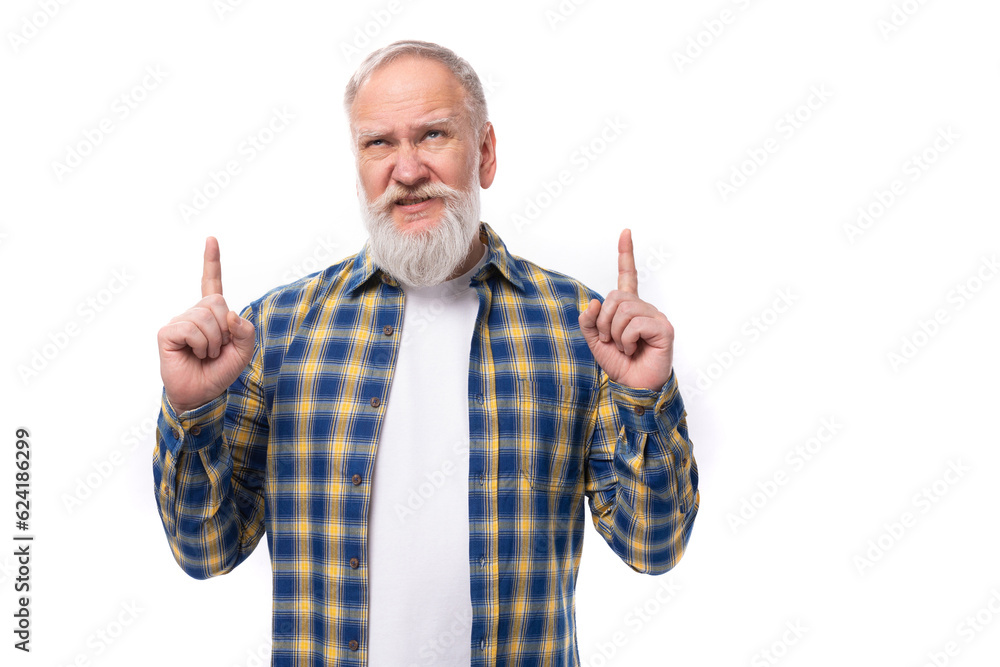 Naklejka premium mature gray-haired retired man with a mustache and beard shows with his hands for the presence of a strategy on a white background