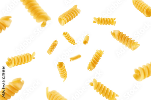 Foto Falling raw Fusilli, Rotini, uncooked Italian Pasta, isolated on white backgroun