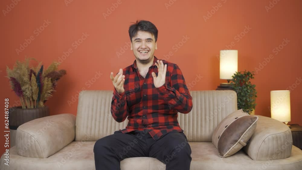 Man giving greeting and applause to camera. Man giving greeting and applause to camera.