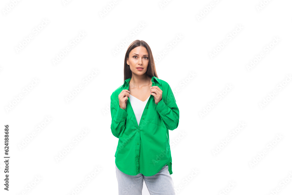 well-groomed bright young brown-haired female model with brown eyes in a green shirt posing on a white background with copy space well-groomed bright young brown-haired female model with brown eyes in a green shirt posing on a white background with copy space