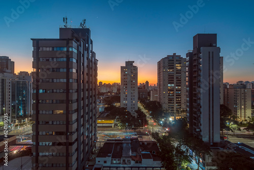 Sao Paulo City. Brazil. Sunset in Campo Belo and Brooklin district. Car traffic on Vereador José Diniz avenue. photo