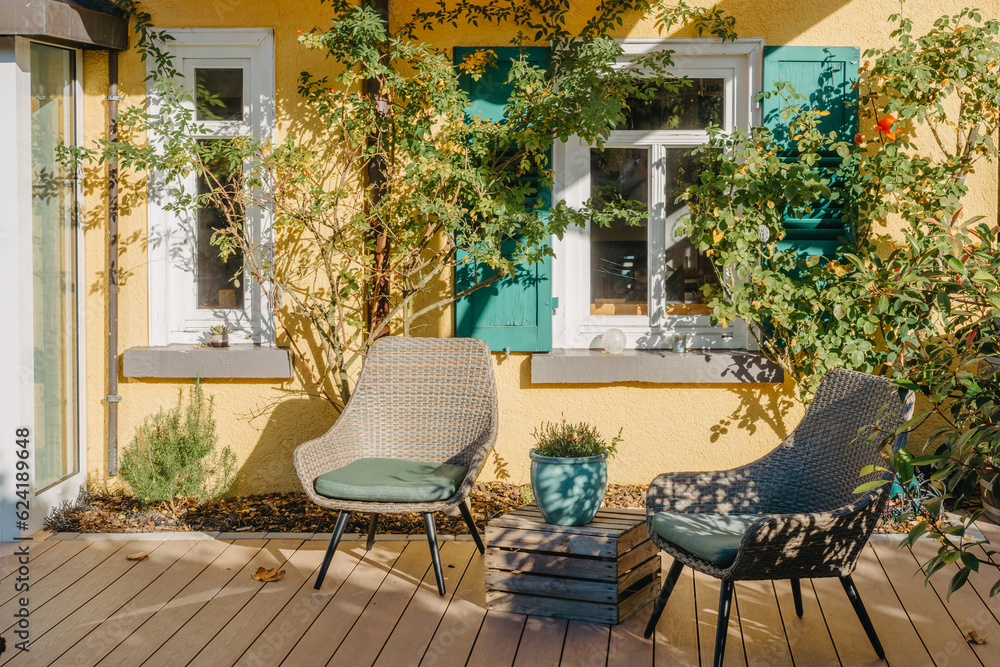 Fototapeta premium Garden Furniture For Leisure Time In Nature. Empty Chairs And Table Table In Orchard. Wooden Outdoor Furniture Set For Picnic In Autumn Garden. Cozy Interior Courtyard With Table And Chair In Village