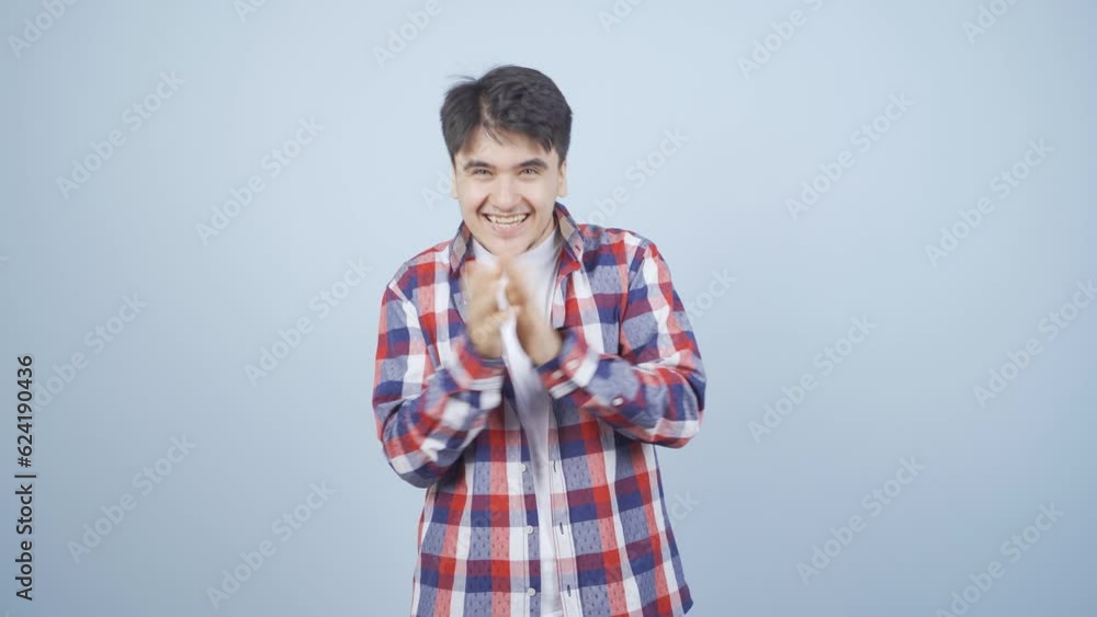 Man clapping excitedly to camera. Man clapping excitedly to camera.