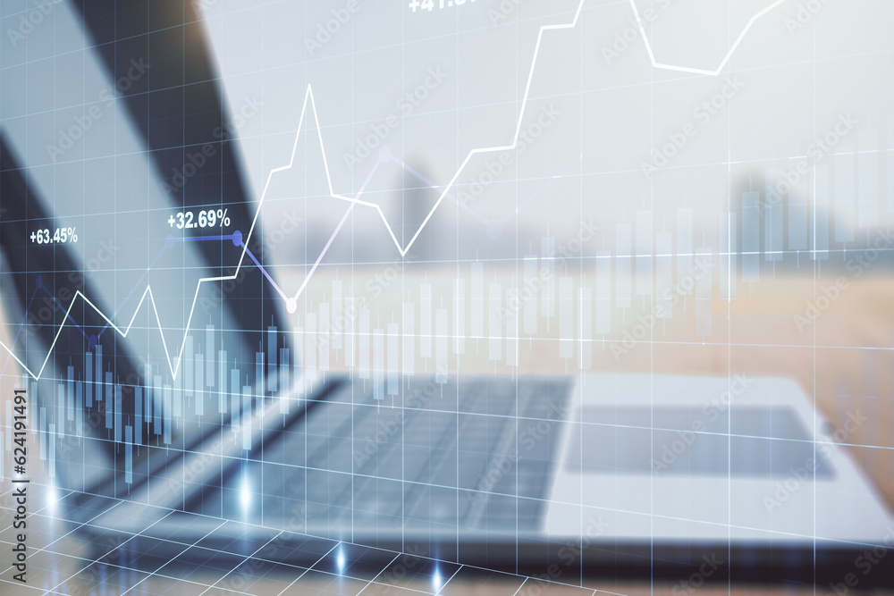 Abstract creative financial graph on modern laptop background, financial and trading concept. Multiexposure Abstract creative financial graph on modern laptop background, financial and trading concept. Multiexposure
