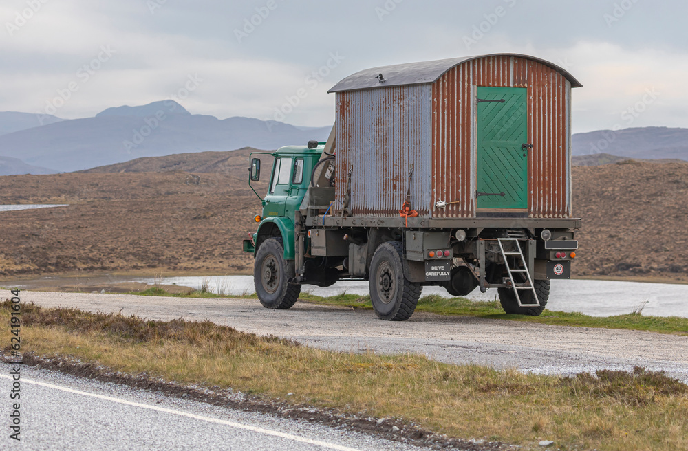 Old fashioned tin shed on the back of a truck