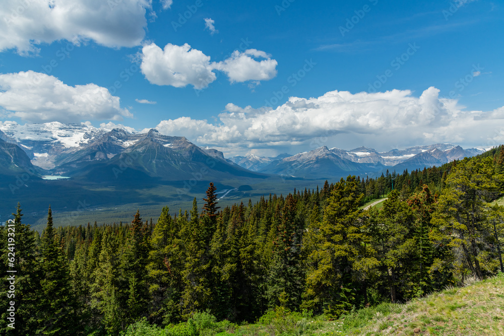 Incredible summer time mountain views in Banff National Park with vast landscape surrounding the national park area. Snow capped mountains near Lake Louise. 