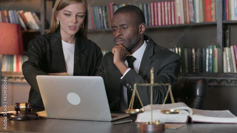 Team of Lawyers Working on Laptop Team of Lawyers Working on Laptop