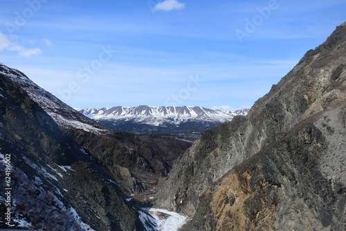 Aerial view of a rugged mountain pass in the Alaska Range.