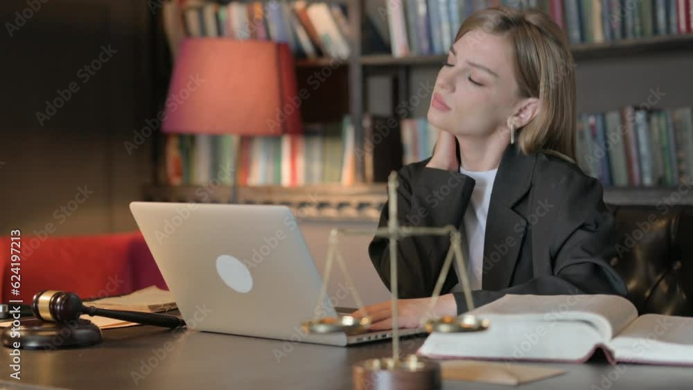 Tired Female Lawyer with Neck Pain in Office Tired Female Lawyer with Neck Pain in Office