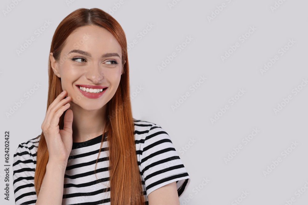 Portrait of beautiful young woman on light gray background, space for text Portrait of beautiful young woman on light gray background, space for text
