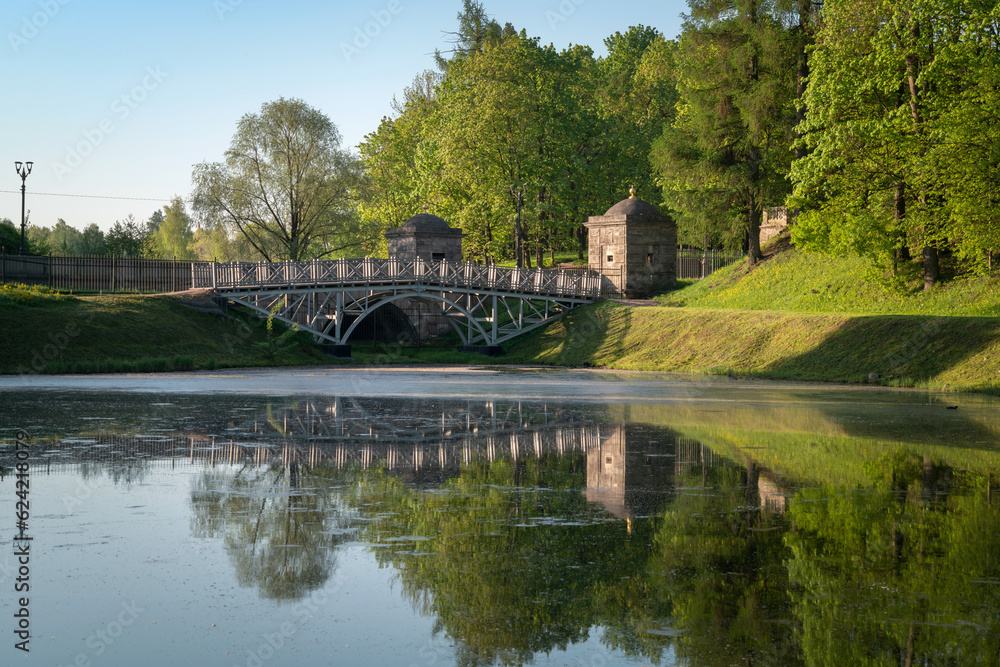 View of the White Lake in Gatchina Park and the stone bridge at the Konetable Square on a sunny summer day, Gatchina, Leningrad region, Russia