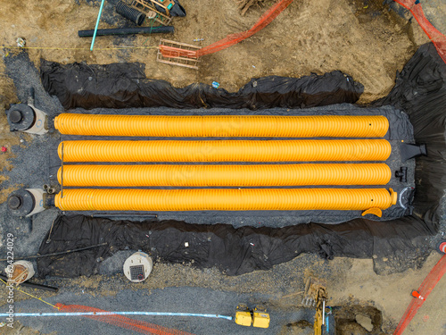 Slika na platnu Yellow underground storm water detention mitigation units on a construction site ready to be covered
