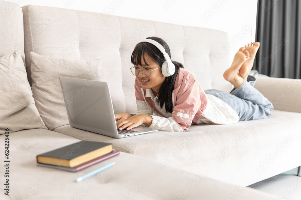 Student girl happy studying online, back to school concept. Young woman student busy study make notes in notebook and using laptop concentrated online training course technology education. Student girl happy studying online, back to school concept. Young woman student busy study make notes in notebook and using laptop concentrated online training course technology education.