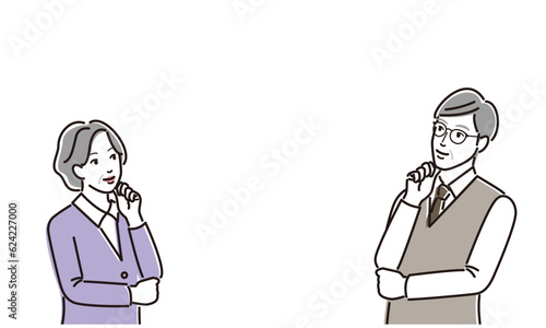 向き合って考える老夫婦