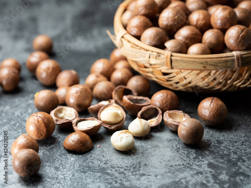 Roasted macadamia nuts on a dark background