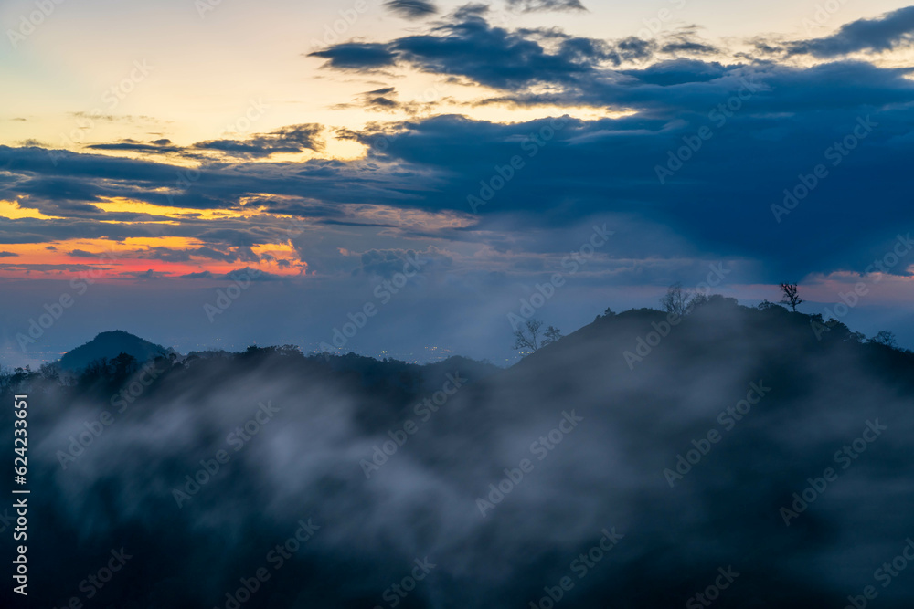 Clouds are moving over the mountains with sunset in the evening (Chiang rai, Thailand)