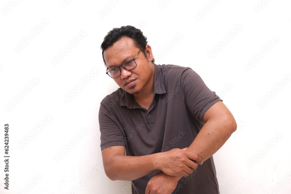 asian man with expression feel pain on hand isolated white background asian man with expression feel pain on hand isolated white background