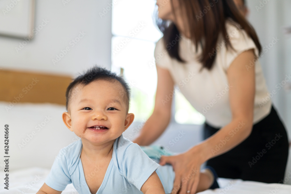 Portrait of happy smile asian baby boy relaxing.Cute asian newborn, child, infant, care, childcare concept on the bed at home