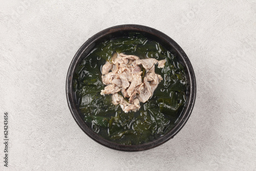 A soup made with seaweed and beef. photo